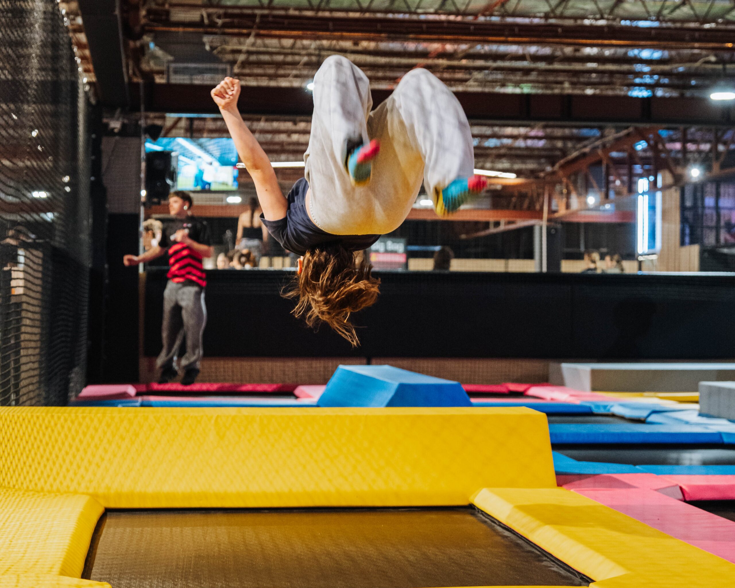 Girl backflipping on trampoline