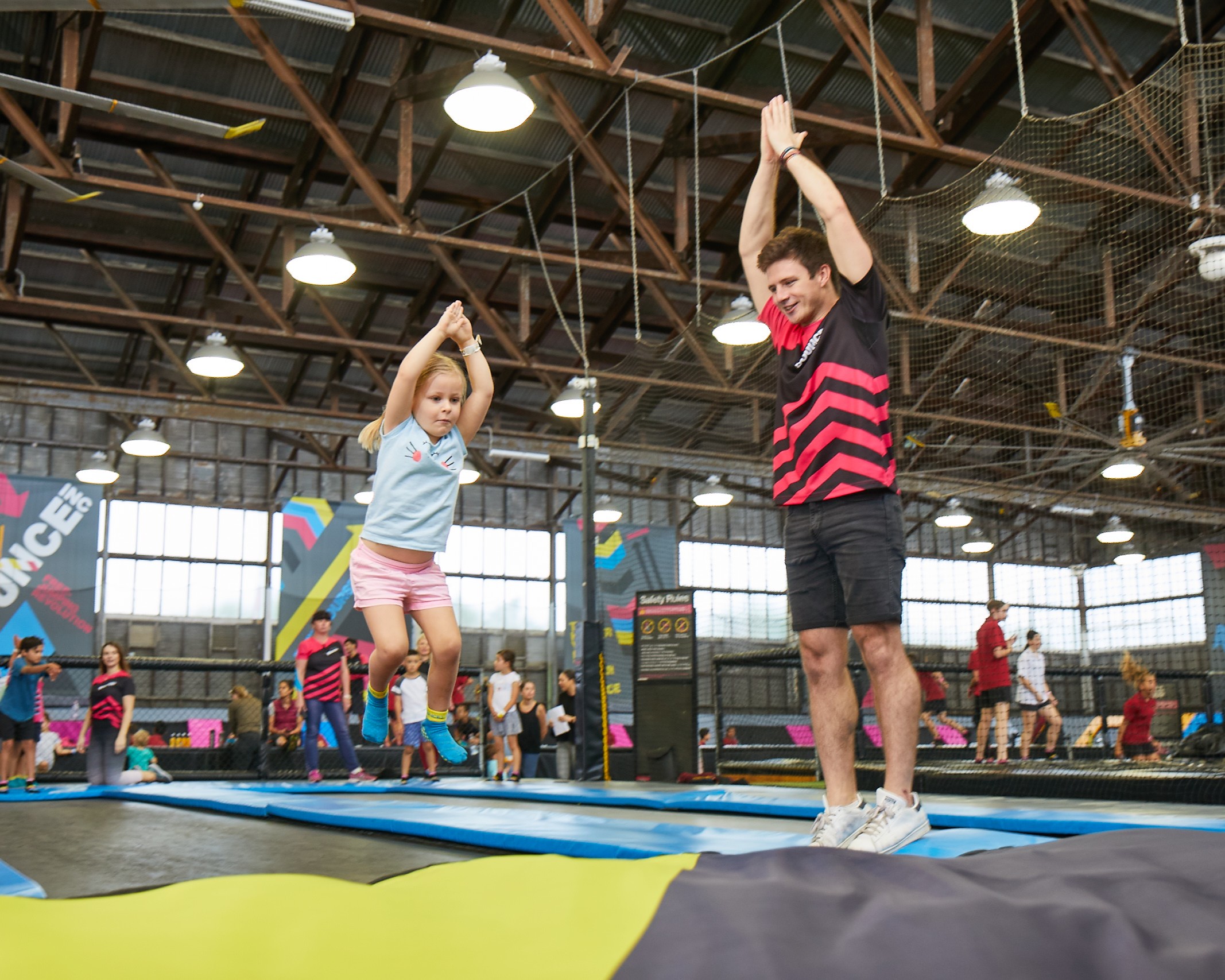 BOUNCE host coaching girl on big bag