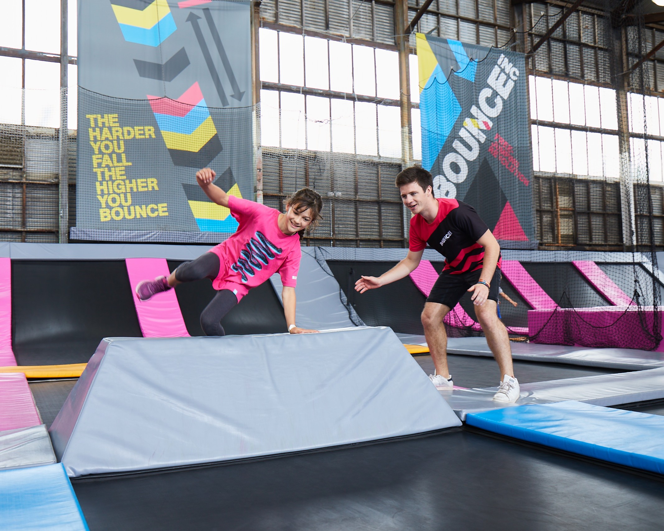 Coach teaching girl to vault
